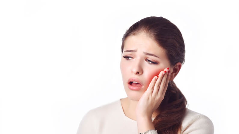 young lady suffering with toothache