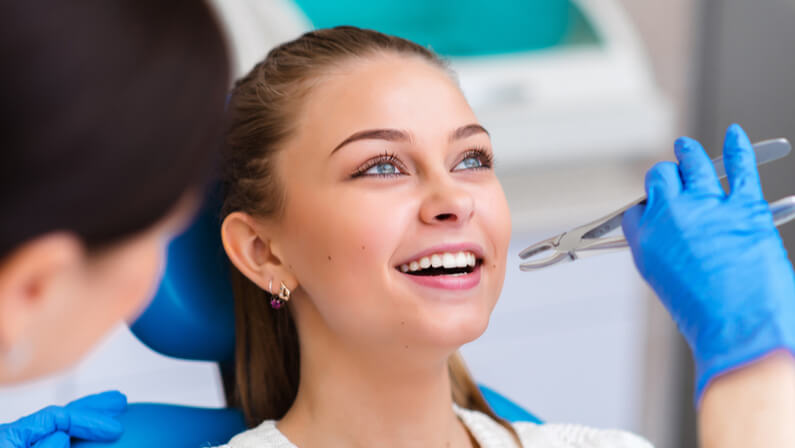 patient under going tooth extraction