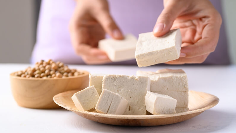 woman eating tofu