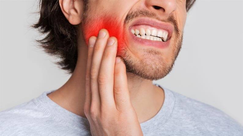 man with tooth and gum problem
