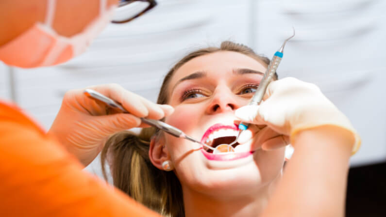 female patient having deep cleaning