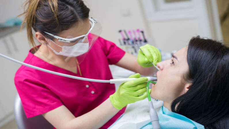 dentist doing deep cleaning