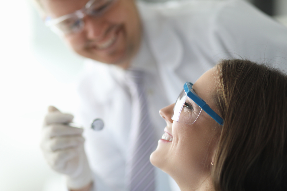 Close-up of smiling beautiful woman visiting professional