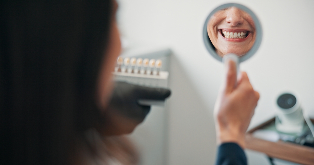 Happy woman, mirror or patient in dental clinic for crown